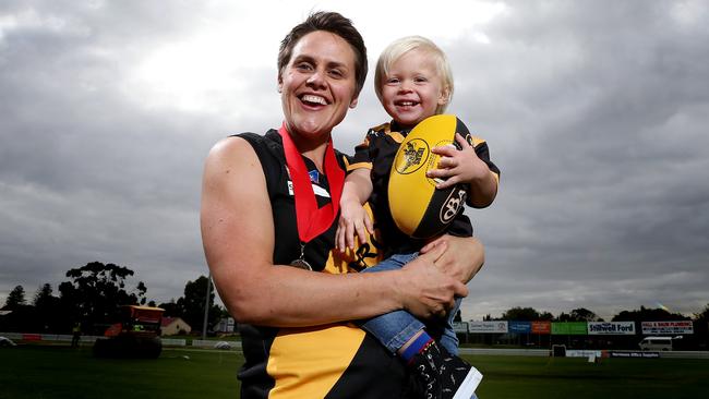 Courtney Gum, pictured with her son Buz, 2, after winning the SANFLW best and fairest while lining up with Glenelg. Gum, now with South Adelaide, was selected by GWS at last week’s AFLW draft.