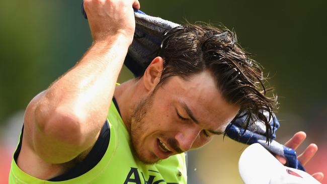 Michael Hibberd towels down at Melbourne training. Picture: Getty Images