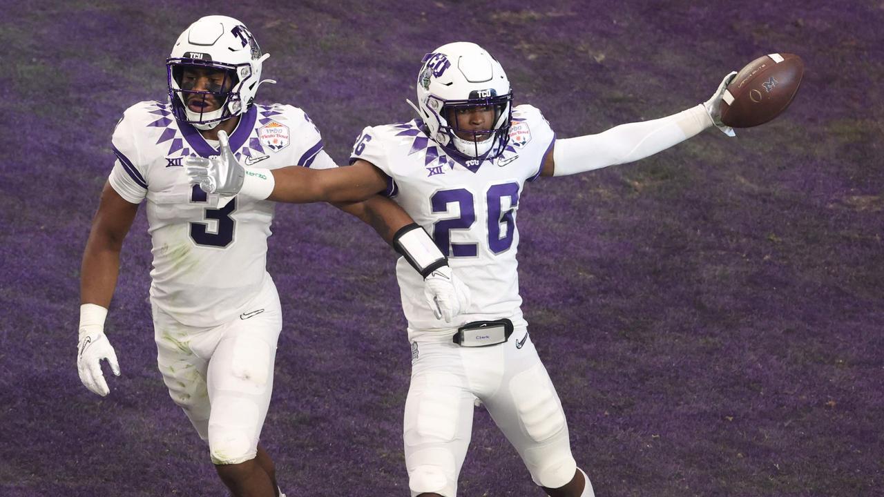 GLENDALE, ARIZONA - DECEMBER 31: Bud Clark #26 of the TCU Horned Frogs celebrates after returning an interception for a touchdown during the first quarter against the Michigan Wolverines in the Vrbo Fiesta Bowl at State Farm Stadium on December 31, 2022 in Glendale, Arizona. Christian Petersen/Getty Images/AFP (Photo by Christian Petersen / GETTY IMAGES NORTH AMERICA / Getty Images via AFP)