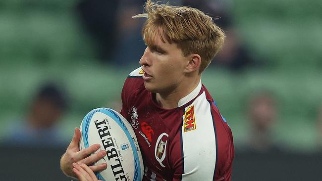 MELBOURNE, AUSTRALIA - MARCH 15: Tate McDermott of the Reds runs with the ball during the round four Super Rugby Pacific match between Melbourne Rebels and Queensland Reds at AAMI Park, on March 15, 2024, in Melbourne, Australia. (Photo by Robert Cianflone/Getty Images)