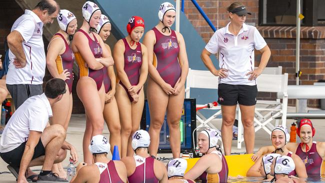 The Thunder squad listening to coach Benn Lees and Australian player Abby Andrews (No. 4). (AAP Image/Richard Walker)