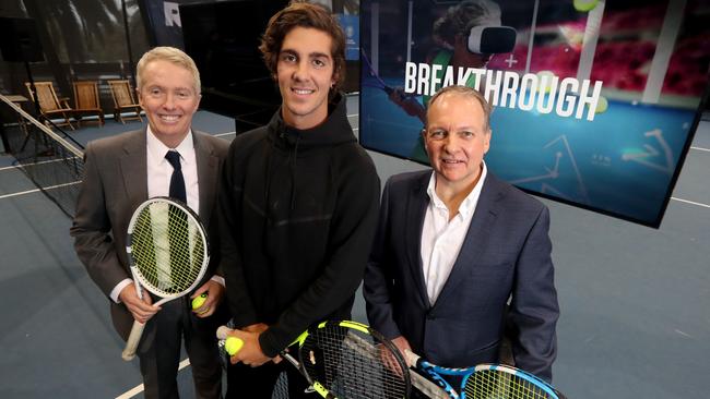 Australia Open tournament director and Tennis Australia CEO Craig Tiley, Australian tennis player Thanasi Kokkinakis and Infosys Australia and New Zealand head Andrew Groth at Melbourne park after announcing Infosys as Australia Open's new tech sponsor, replacing IBM. Picture : David Geraghty / The Australian.