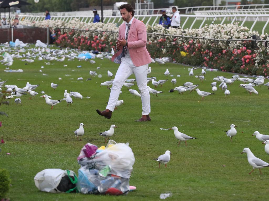 Racegoers are seen at the end of the Lexus Melbourne Cup Day, as part of the Melbourne Cup Carnival, at Flemington Racecourse in Melbourne, Tuesday, November 6, 2018. (AAP Image/Dave Crosling) NO ARCHIVING, EDITORIAL USE ONLY