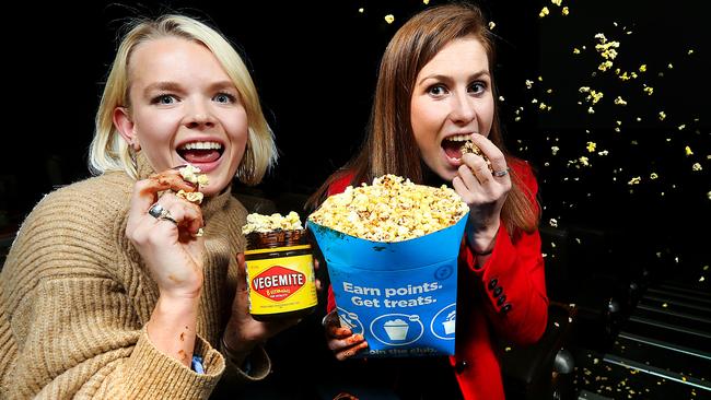 Francesca Edge-Partington and Poppy Ranicar try some Vegemite and cheese-flavoured popcorn. Picture: Ian Currie