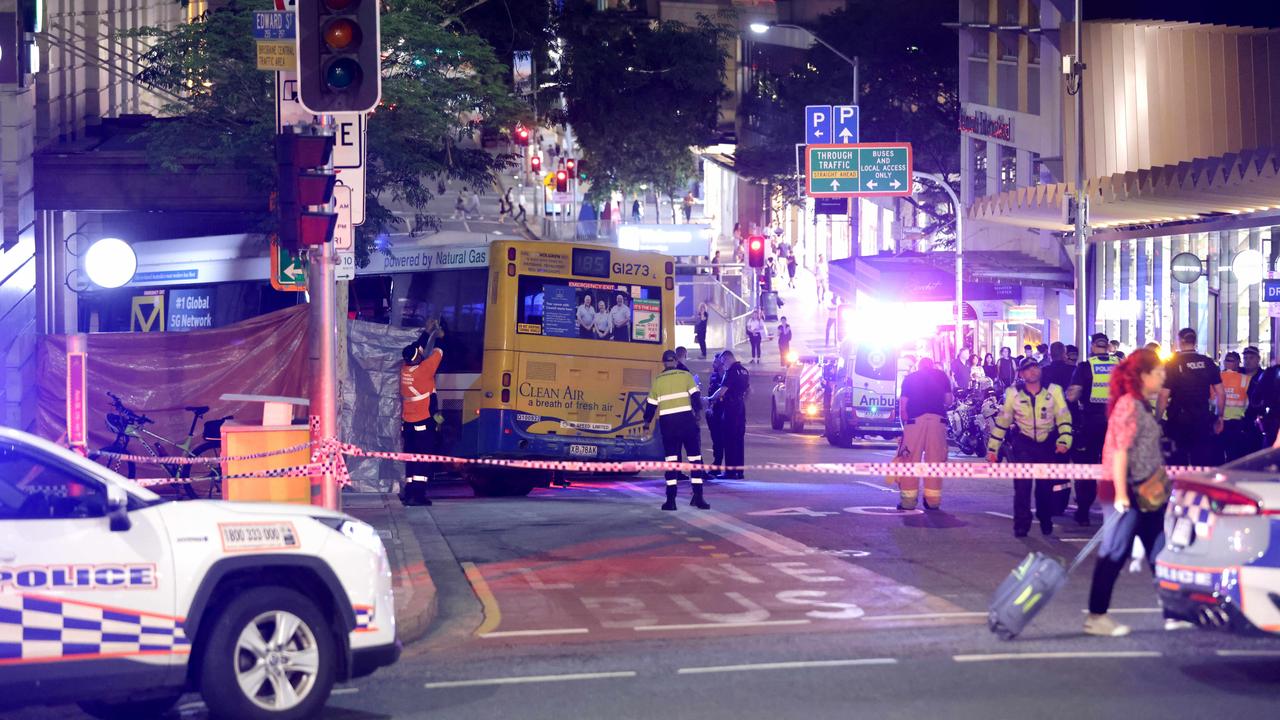 The scene of the incident after dark, with Edward Street still closed as the bus remains in place. Photo Steve Pohlner