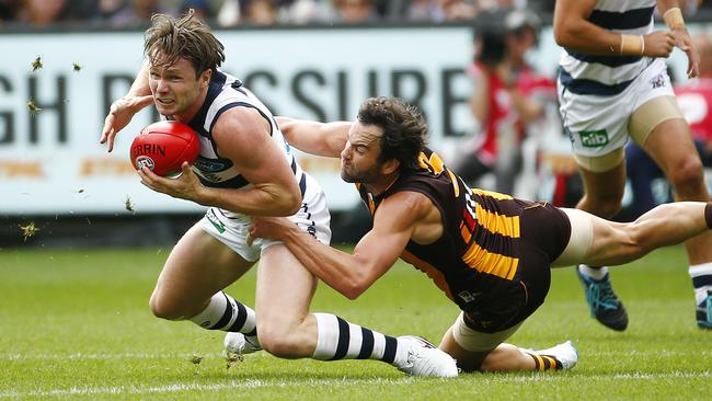 AFL - Round 1 - Geelong v Hawthorn at MCG , Geelong's Patrick Dangerfield gets tackled by Hawthorn's Jordan Lewis. 28th March 2016. Picture: Colleen Petch.
