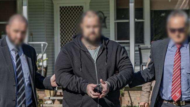 Mitchell Callaway (centre) being arrested in 2023. Picture: NSW Police