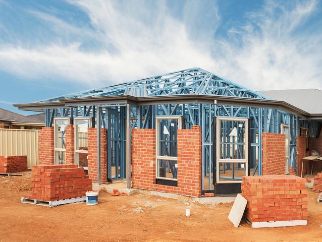 New residential construction home from brick with metal framing against a blue sky; real estate Australian generic suburban homes