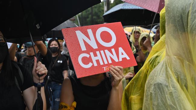 Taiwanese people march in the streets outside the parliament in Taipei during a demonstration to support Hong Kong’s pro-democracy protests.