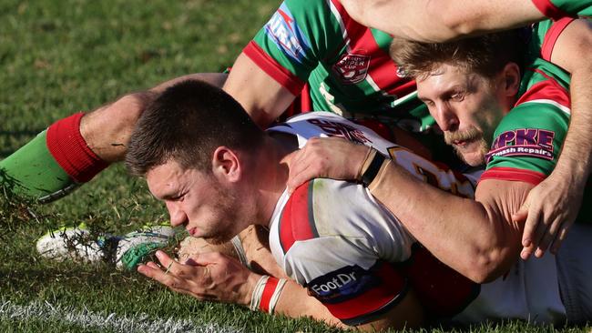 Tom Opacic scores for the Redcliffe Dolphins.