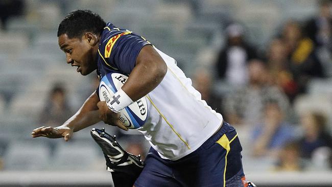 CANBERRA, AUSTRALIA - MARCH 31: Ita Vaea of the Brumbies is tripped by Bismark du Plessis of the Sharks during the round six Super Rugby match between the Brumbies and the Sharks at Canberra Stadium on March 31, 2012 in Canberra, Australia. (Photo by Stefan Postles/Getty Images)