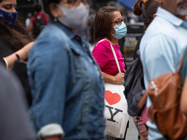 Many Americans have also gone back to wearing masks outside. Picture: AFP