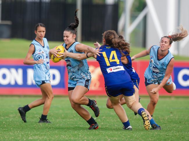 Dominique Carbone (ball) as Buffettes v Wanderers women's footy.Picture GLENN CAMPBELL