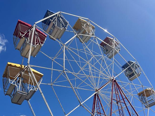 Show goers ride the ferris wheel