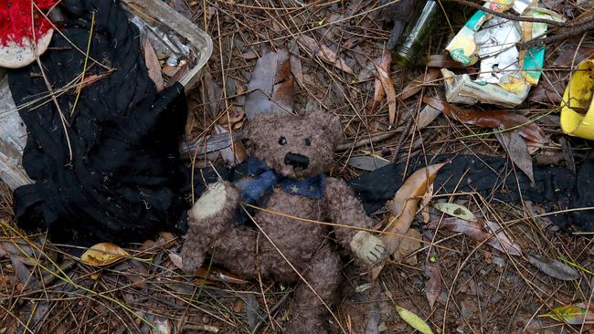 A child’s teddy bear is left on the soggy ground in Tent City when a family left to seek shelter on a friend’s couch after the skies opened. Picture: Toby Zerna