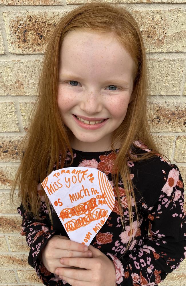 Mila Leitch, 7, with art for her grandparents, Lesley and Peter Kowalenko. Picture: Supplied.