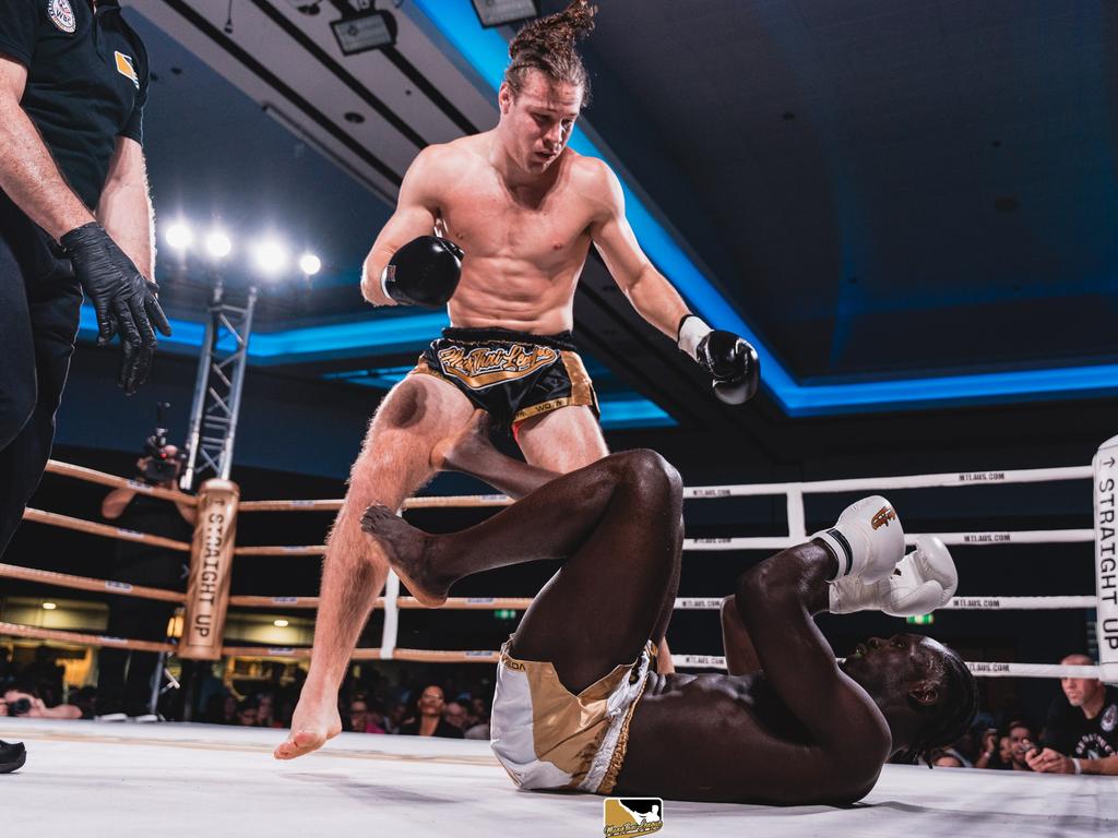 Jayden Eynaud stands over Gerardo Atti in his MTL11 win for the WBC Muaythai Cruiserweight world title. Picture: Brad Scott Photography.