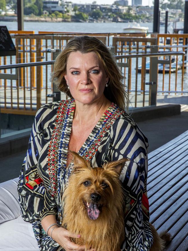 New Farm resident Annie Boxall at New Farm Ferry Terminal with her dog Banjo, Saturday, January 19, 2019 (AAP Image/Richard Walker)