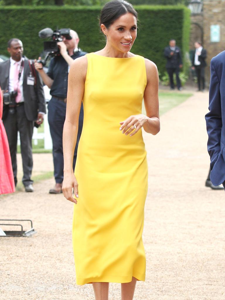 Meghan in yellow at the Commonwealth Youth Challenge in July 2018. Picture: Yui Mok – WPA Pool/Getty Images