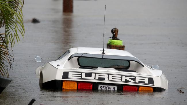 A car at Telegraph Point north of Port Macquarie, was inundated with flood waters. Picture: Nathan Edwards