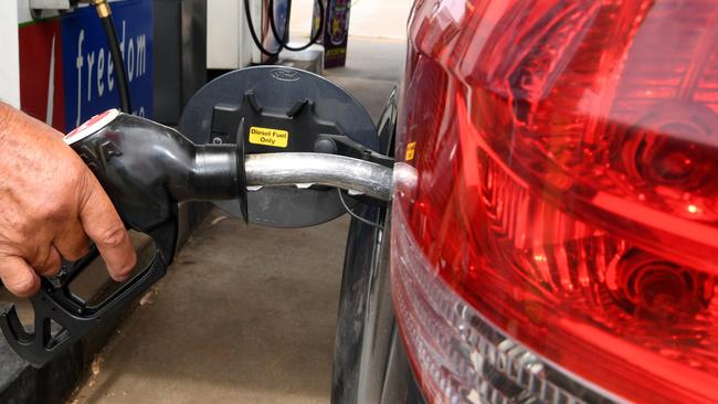 Filling up at a petrol station. News Regional Media