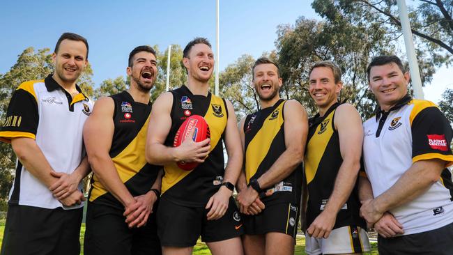 St Paul's Old Scholars president Jake Winters, players Nicholas Morasca, Matt Rowson, Joe Adamo, Liam Davies and coach Damien Stagg in high spirits ahead of the reborn club’s first grand final appearance. Picture: AAP/Russell Millard