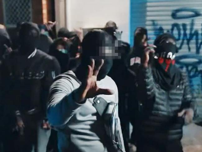 Screenshots as street gangs linked to murders and violent crimes across Brisbane boast about their brazen actions online in rap music videos, dissing other gangs which often include members as young as 12 years old. Source: YouTube