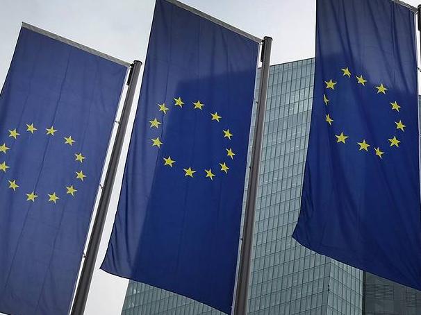 The gap in yields between Eurozone high-grade debt and safer government bonds has widened. PHOTO: AGENCE FRANCE-PRESSE/GETTY IMAGES European Union flags