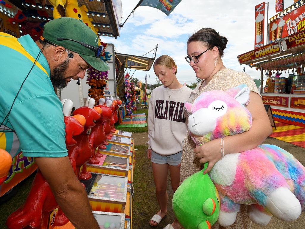 Jasmine with her sister Breanna Parish having one more turn each at sideshow alley at the Lismore Show. Picture: Cath Piltz