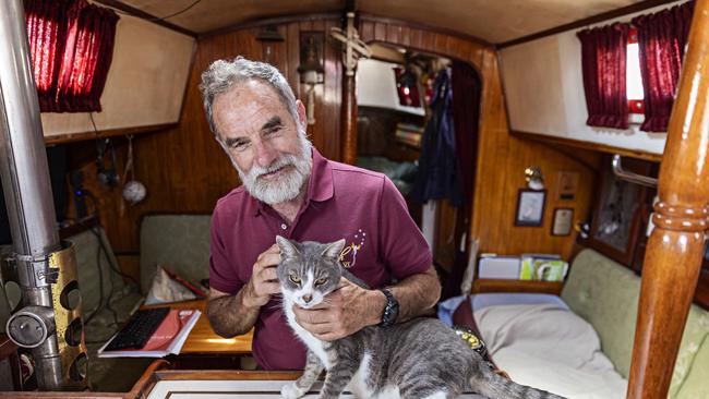 SYDNEY, AUSTRALIA, NOVEMBER 22, 2023. Sylph VI skipper and owner Robert â€˜Bobâ€™ Williams with his cat Oli who will sail with Bob in the Sydney to Hobart yacht race on board Sylph VI. Photographer: Adam Yip