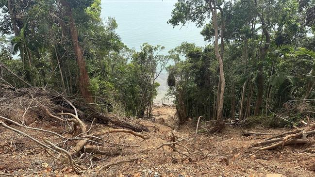 Landslides run for hundreds of metres down cliff faces and into the ocean on the Bloomfield Track between Wujal Wujal and Cape Tribulation.