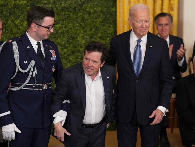 Actor Michael J. Fox receives the Medal of Freedom from Joe Biden. Picture: AFP