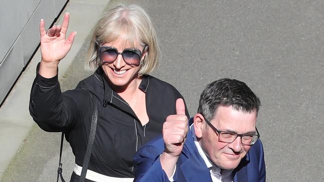 Victorian Premier Daniel Andrews, with wife Catherine, calls it quits in Melbourne on Tuesday. Picture: David Crosling