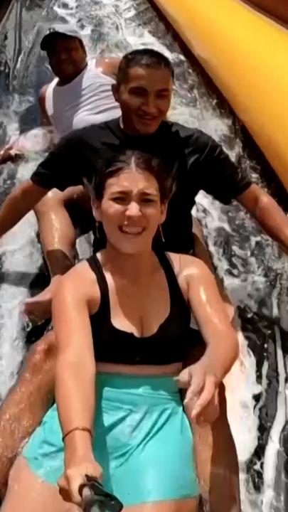 Colombian town turns main street into giant water slide