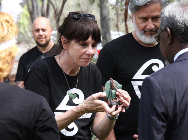 Air New Zealand's Kiri Hannafin and Tupara Morrison hand over the  taonga to Arrernte Elders Benedict Stevens and Rosalie Ngkwarraye Riley at Alice Springs Airport, October 7, 2024. Picture: Gera Kazakov