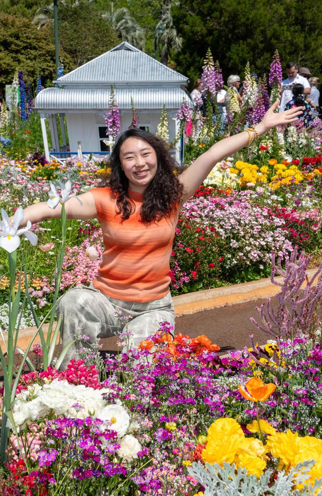 Leslie Niu enjoys the Botanic Garden display in Queens Park during the Carnival of Flowers, Sunday, September 22, 2024. Picture: Bev Lacey