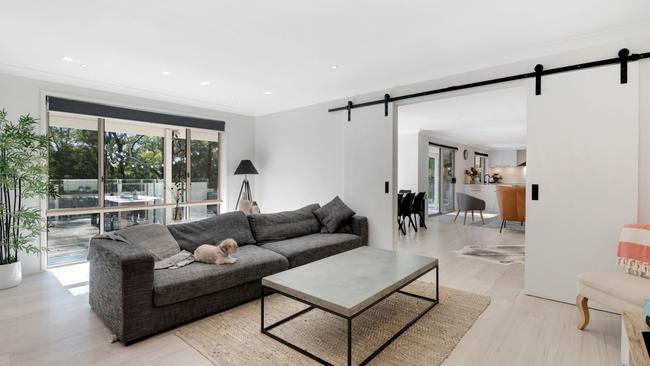 The Contemporary loungeroom has a sliding barn door.