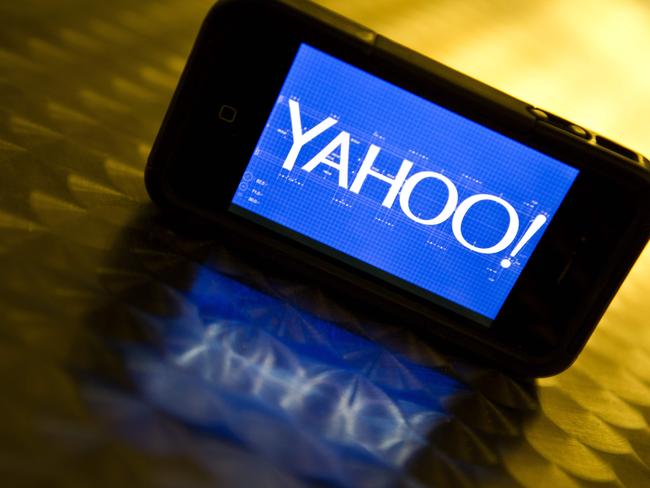 (FILES) This file photo taken on September 12, 2013 shows the Yahoo logo seen on a smartphone in Washington, DC. Yahoo beat expectations on October 18, 2016 with quarterly earnings that showed profit more than doubled to $163 million despite only a slight rise in revenue. "We remain very confident, not only in the value of our business, but also in the value Yahoo products bring to our users' lives," Yahoo chief executive Marissa Mayer said, adding that the company is busy preparing to complete a deal to be acquired by Verizon. / AFP PHOTO / KAREN BLEIER