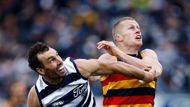 Jonathon Ceglar of the Cats and Reilly O'Brien of the Crows compete in a ruck contest. Photo by Dylan Burns.