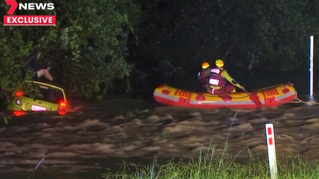 A body has been found in a submerged car after floods and heavy rain struck Queensland’s south west. Credit: 7 NEWS