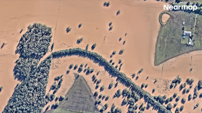 The natural disaster caused five confirmed fatalities and left more than 50,000 people isolated. Pictured: Oxley Island after. Picture: Nearmap