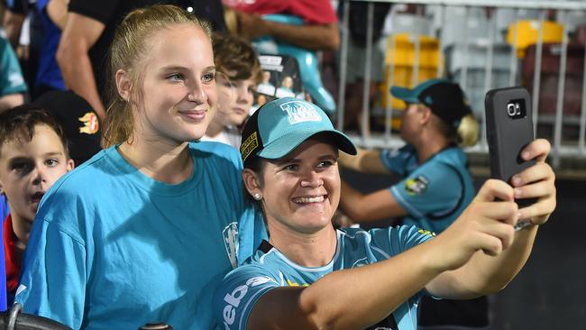 Jess Jonassen grabs a selfie with a fan at Cazaly's Stadium. Picture: Ian Hitchcock