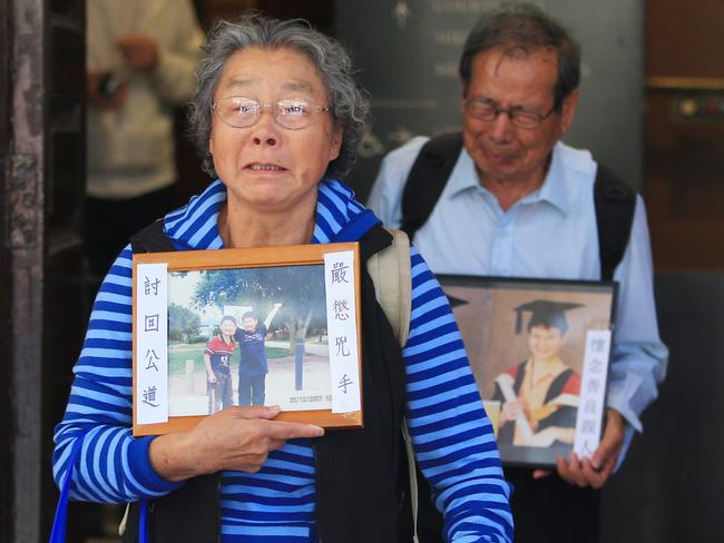 The parents of Min Lin and Kathy Xie weep as they leave the Supreme Court after Robert Xie was found guilty of murdering five members of his family. Picture: Mark Evans