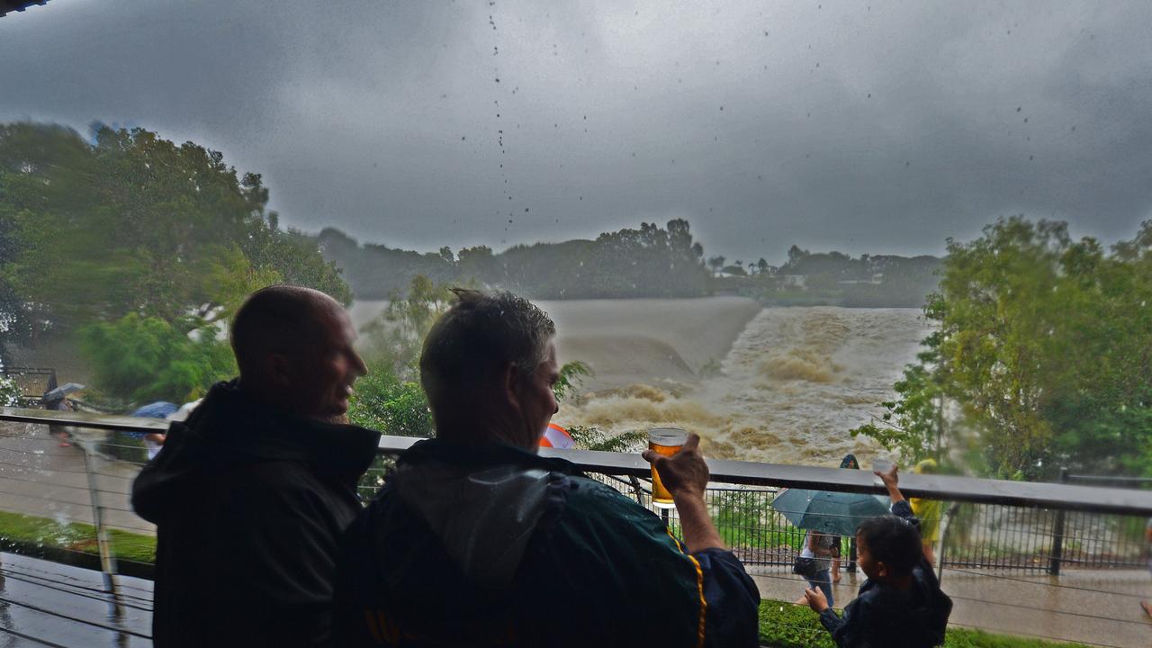 Locals take a look at Blacks Weir, Douglas from the Riverview Tavern while having a beer. Picture: Zak Simmonds