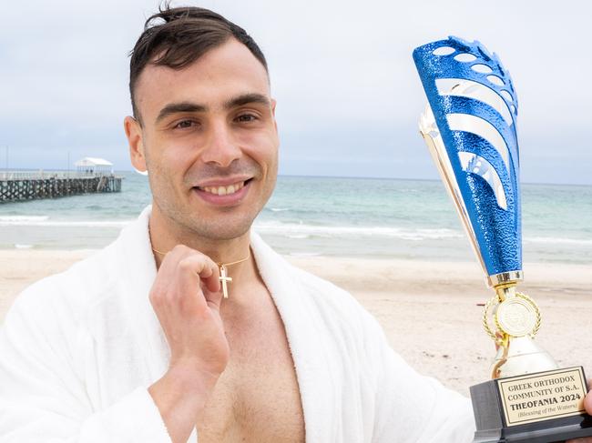 George Langanis, 29, from Lightsview, who caught the cross at the blessing of the waters by the Greek Orthodox Church at Henley Beach, Henley on Sunday, January 7, 2023. (The Advertiser/ Morgan Sette)