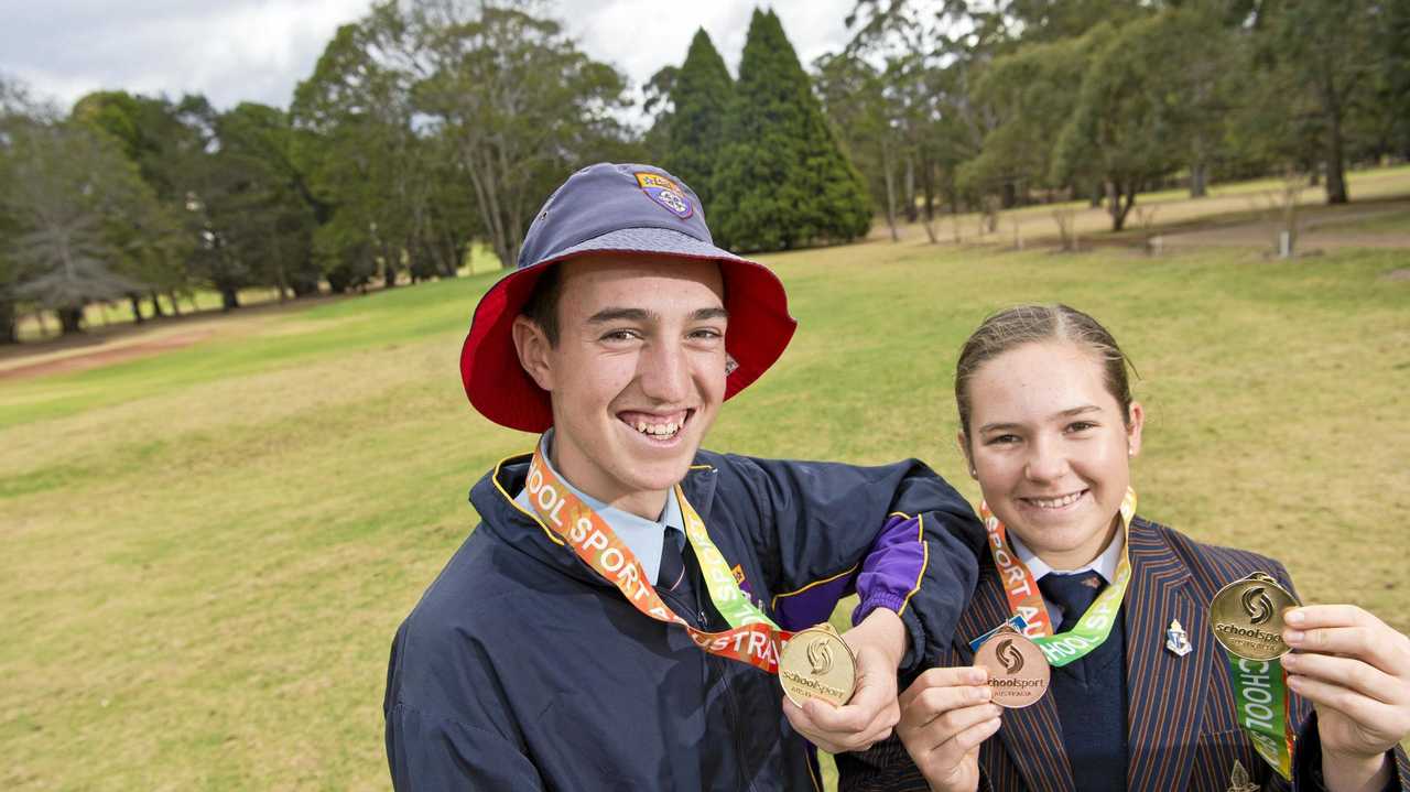 Toowoomba junior golfers Quinn Croker (left) and Kamryn Dunemann show their medals from the 2018 School Sport Australia under-17 golf championships. Picture: Kevin Farmer