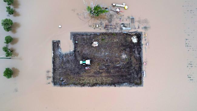 A tractor rests on a small paddock surrounded by floodwater at Coraki, in northern NSW, on March 7, 2022. Picture: Dan Peled/Getty Images