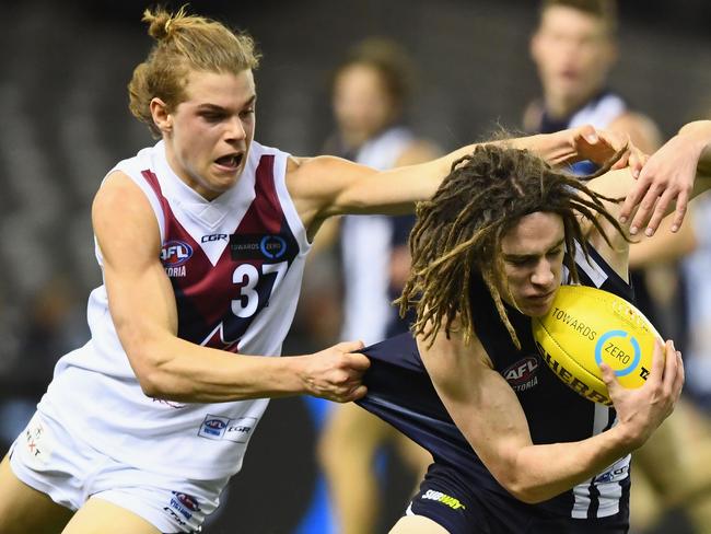 Bailey Smith tries to keep Gryan Miers under wraps when they faced off in the TAC Cup Grand Final.