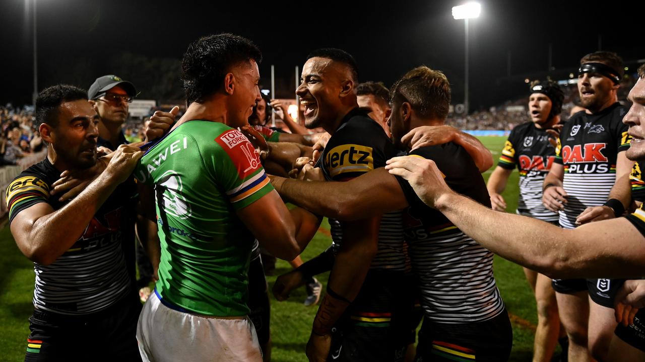 Panthers and Raiders players come together. NRL Imagery