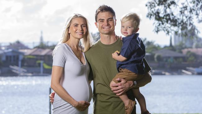 Supercars driver Tim Slade with partner Dani and 2-year-old Jordy.  Dani and Tim are expecting their second child in January. Tim will be racing in this year's  GC500 in Surfers Paradise .  Picture: Jerad Williams